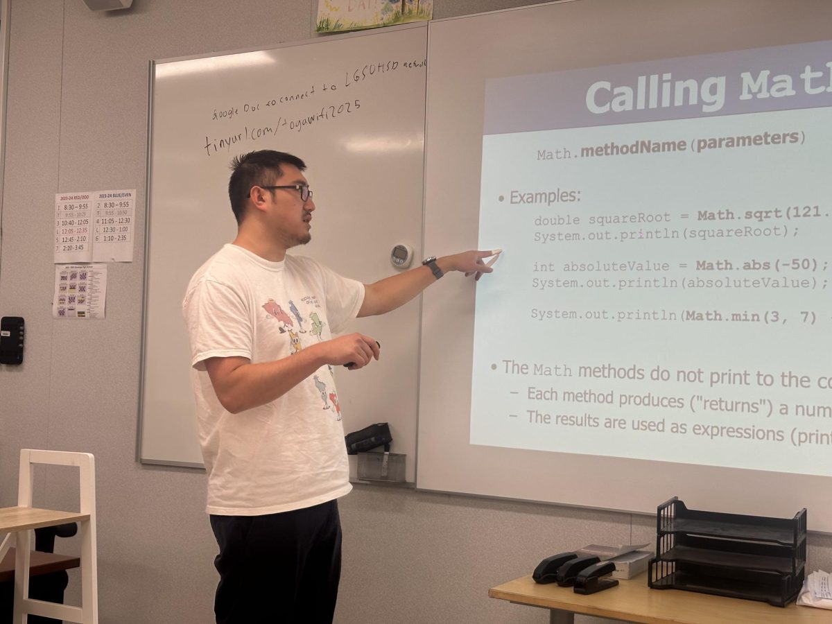 Wang teaches his period 2 AP Computer Science class how to call math functions in Java.