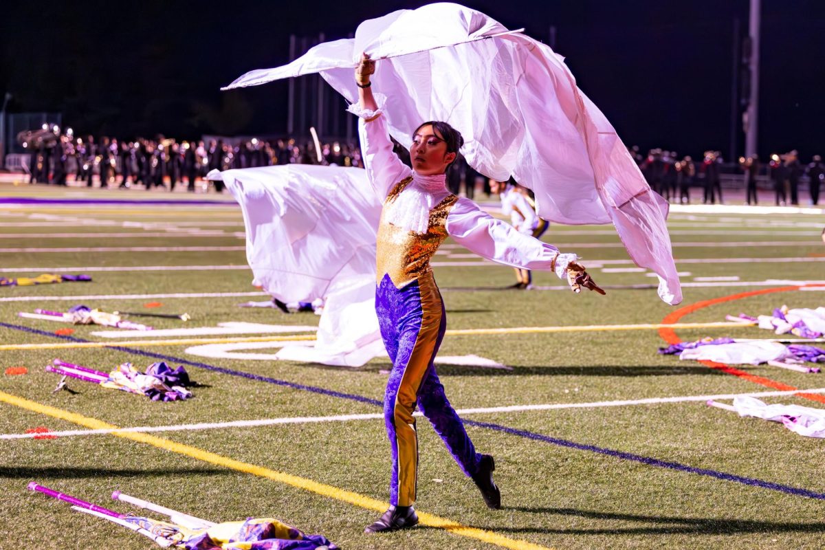  Courtesy of Isabelle Gecils

Xu raises her flag in color guard.