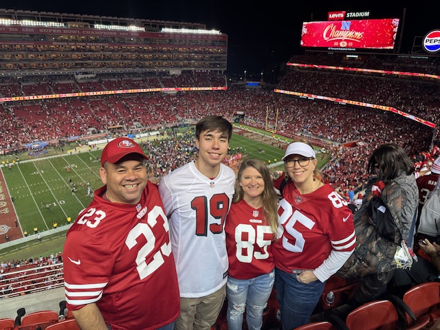  Courtesy of Greg Louie 
Louie at the National Football Conference (NFC) championship game where the 49ers defeated the Detroit Lions.