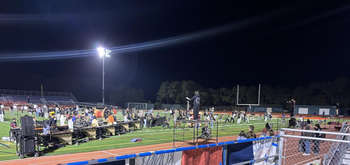 The marching band prepares for a final run-through of their whole performance.