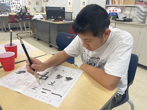 Chinese 3 students practiced calligraphy in their classroom.