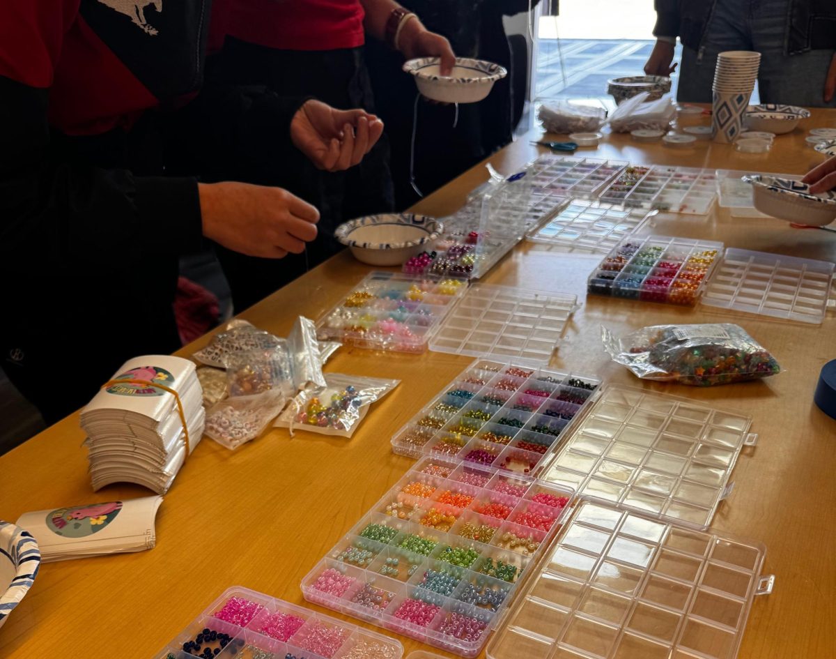 Students select their beads to make their own bracelets in the student center.