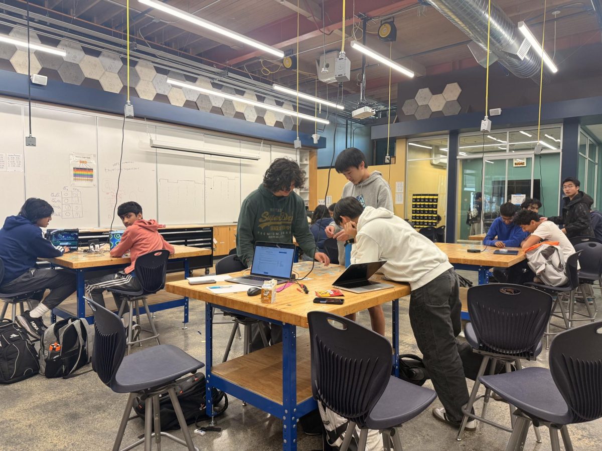 Students work on a puzzle during class.