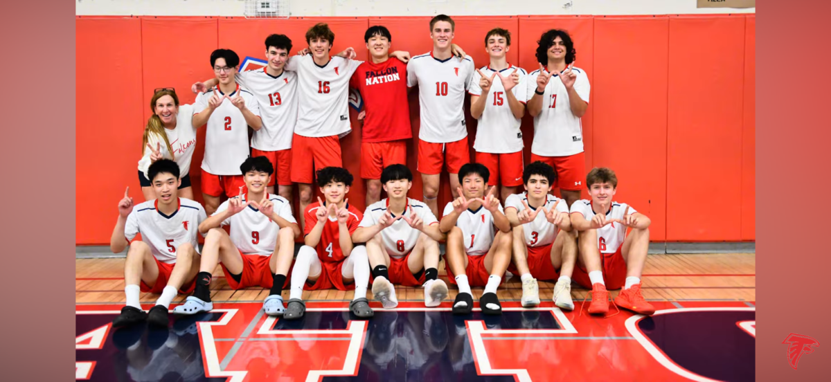 The Falcons pose for a team photo after winning their first home game against Westmont.