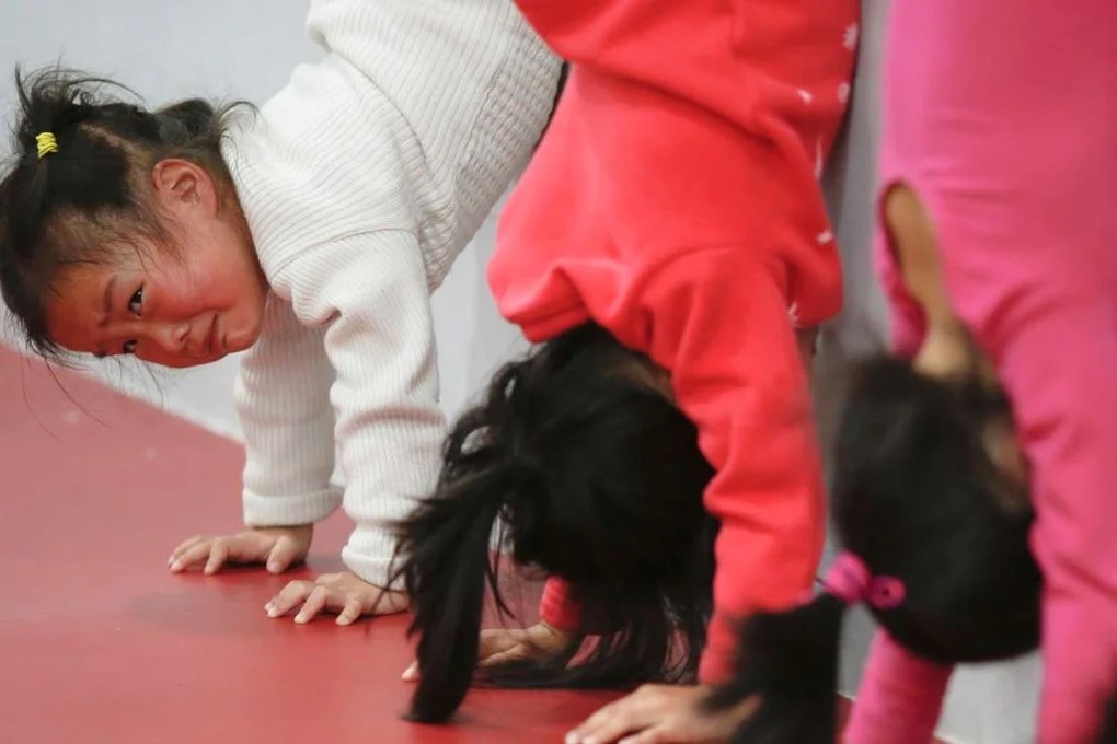  Courtesy of Reuters

Children as young as four are recruited into sports schools and spend their lives training for their sports.