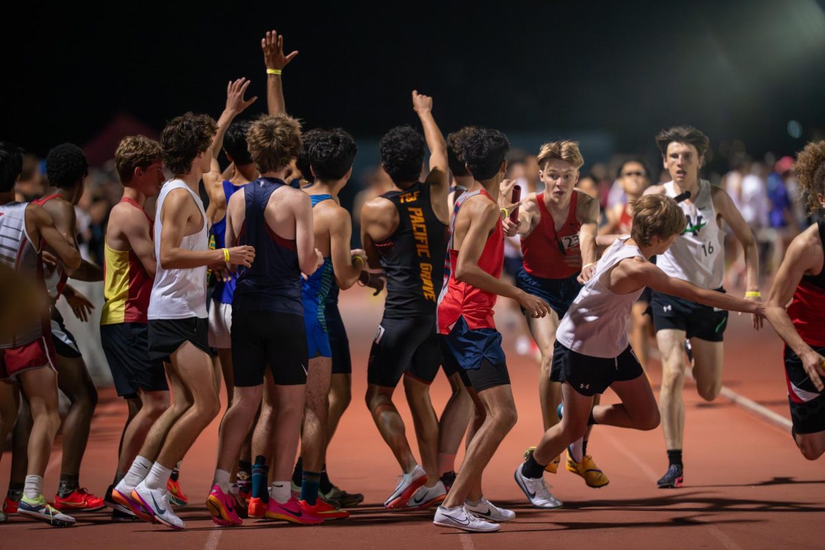  Courtesy of Todd Tokubo
Junior Max Nyden hands off the baton to sophomore Advay Salhotra in the Dublin Distance Fiesta on March 21.