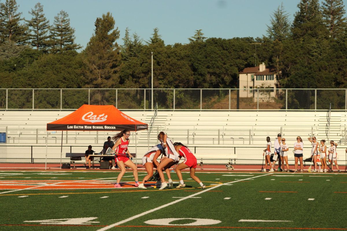 Seniors Anjali Sahni and Thalea Charton fight for the ground ball