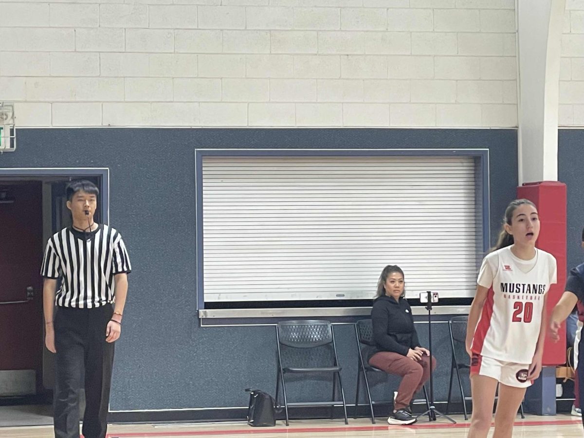  Courtesy of Nathan Liu
Liu referees during a girls’ youth basketball game.