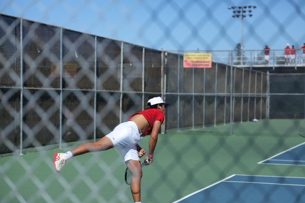 Senior Somei Ogata finishing a serve.