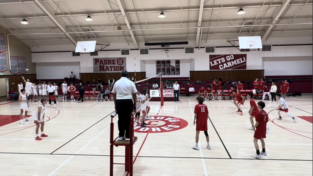  Courtesy of Lawrence He
The team gets ready to serve receive against Carmel High.