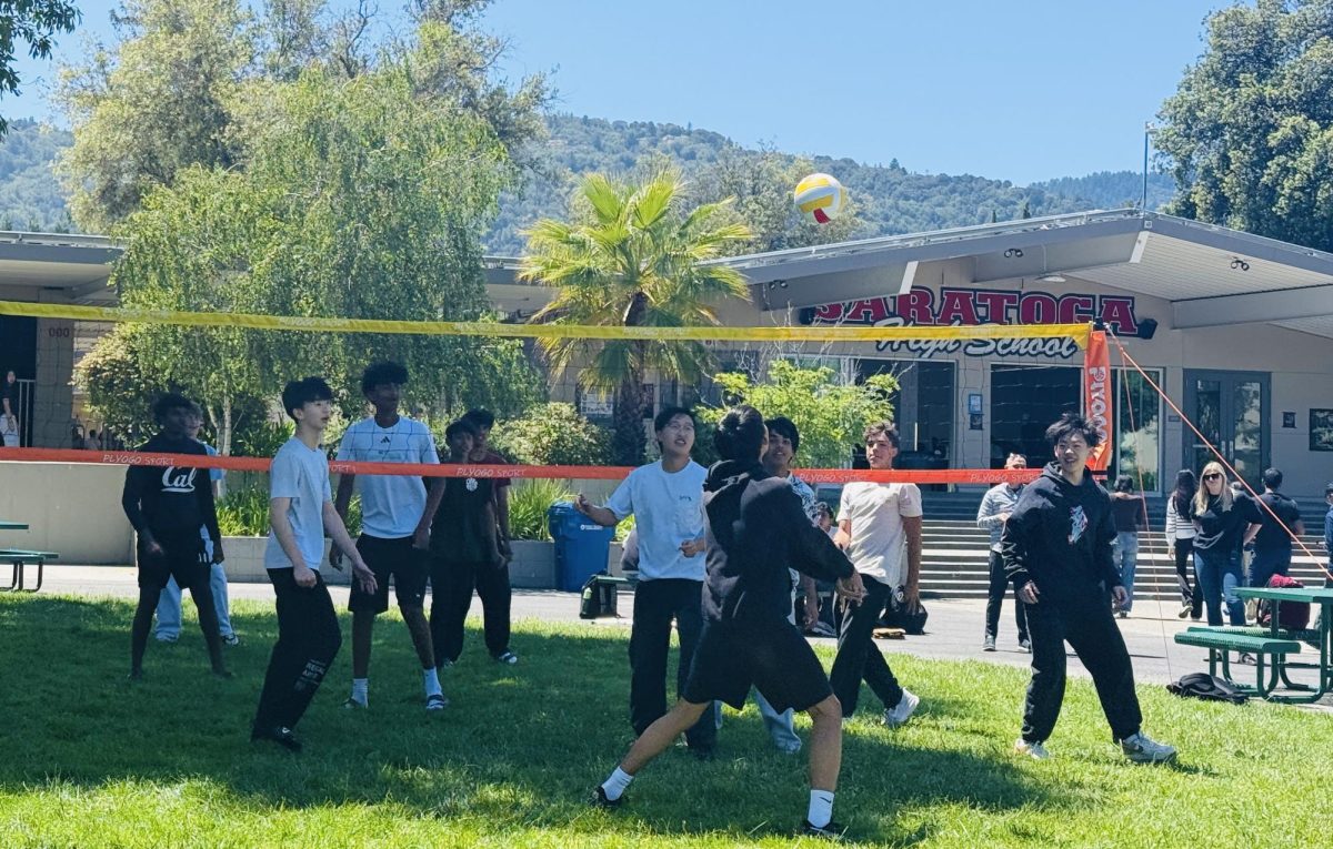 At lunch, students gather in the quad to play an exciting game of volleyball.