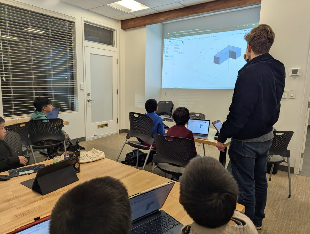 One of Hoang’s past students, Gonzalo Fernandez (12) teaches a 3D modeling class at IRA.