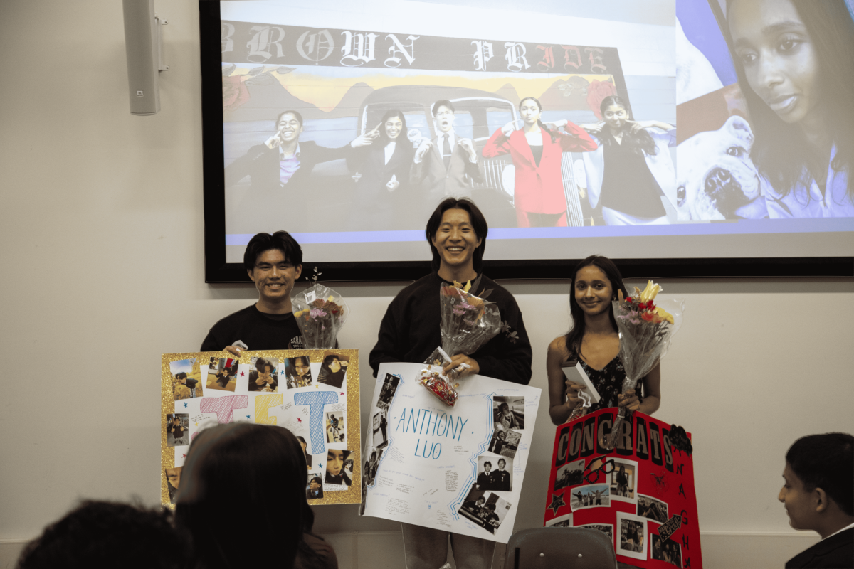 Seniors Anthony Luo, Jet Tsang and Anagha Vitaldevara posing with their posters